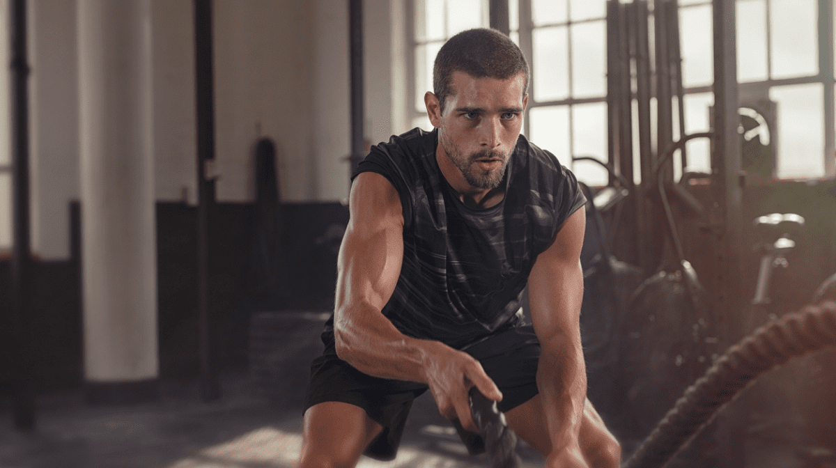 man working out with creatine supplements
