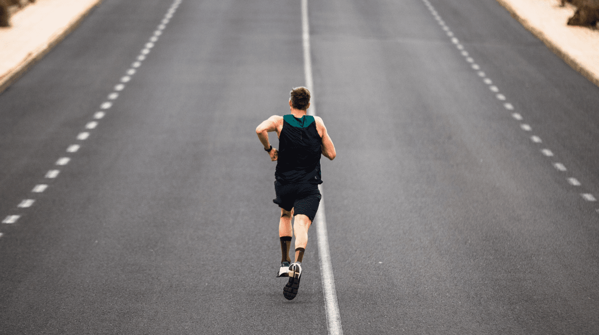 klean athlete running on road