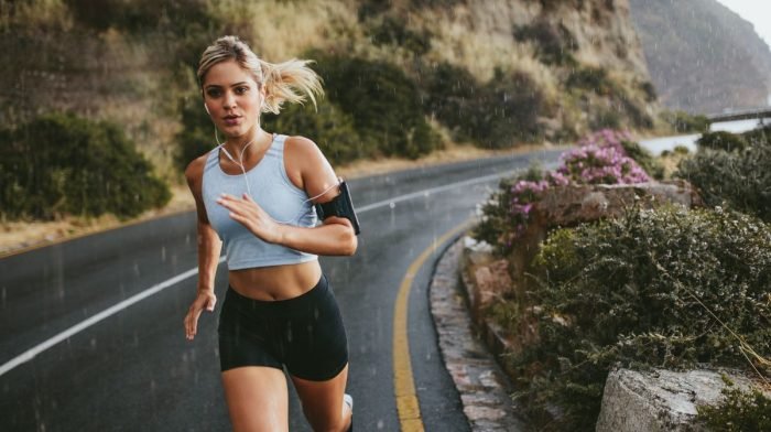 Female athlete running after waking up tired with no energy