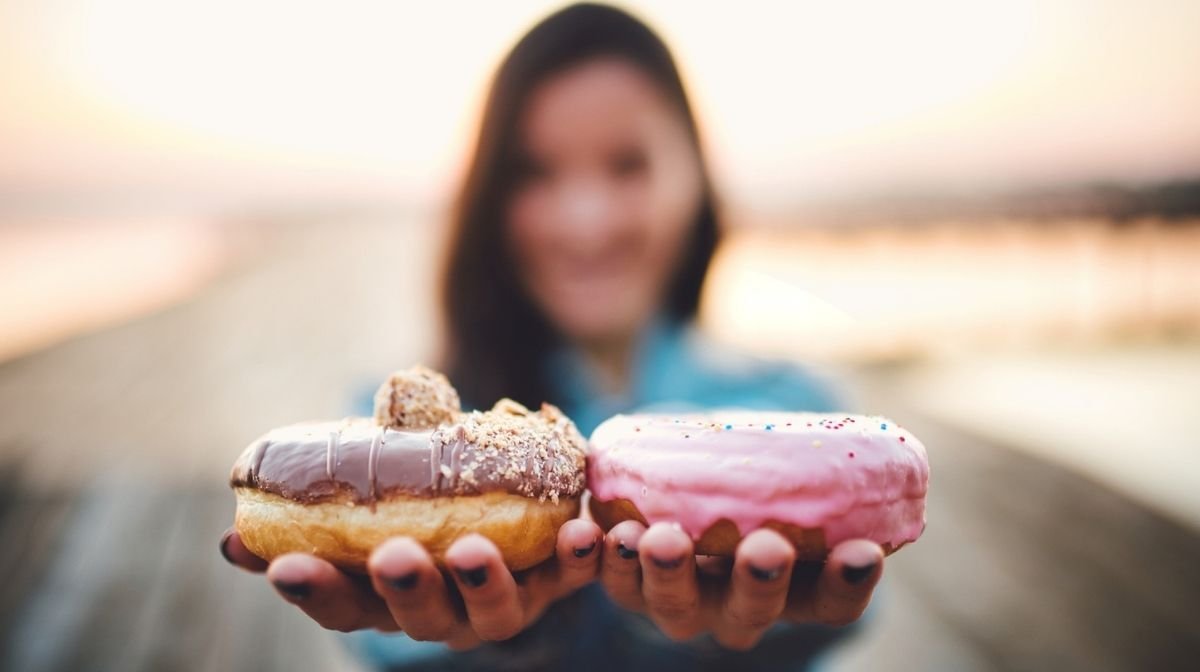 woman resisting the temptation of doughnuts
