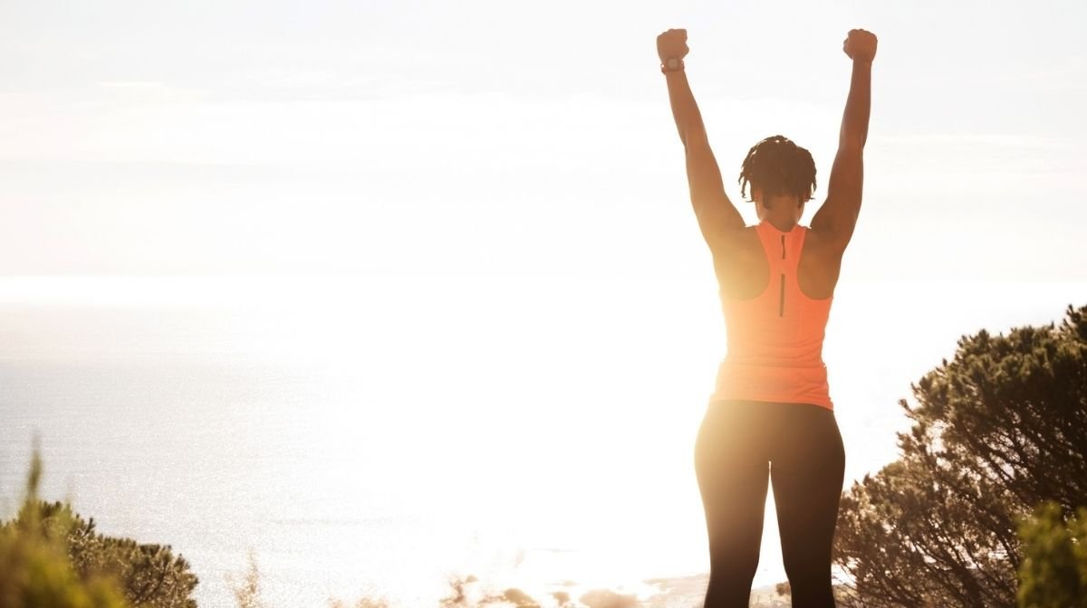 woman looking after her body by exercising outdoors