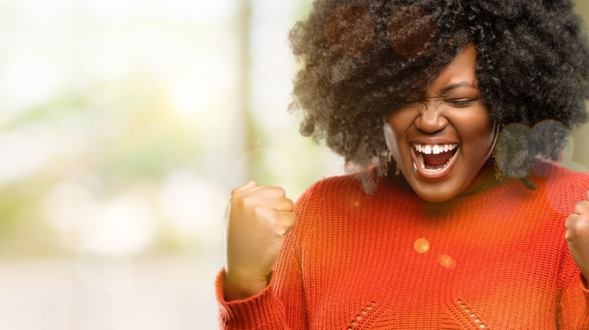 woman celebrating after achieving goals
