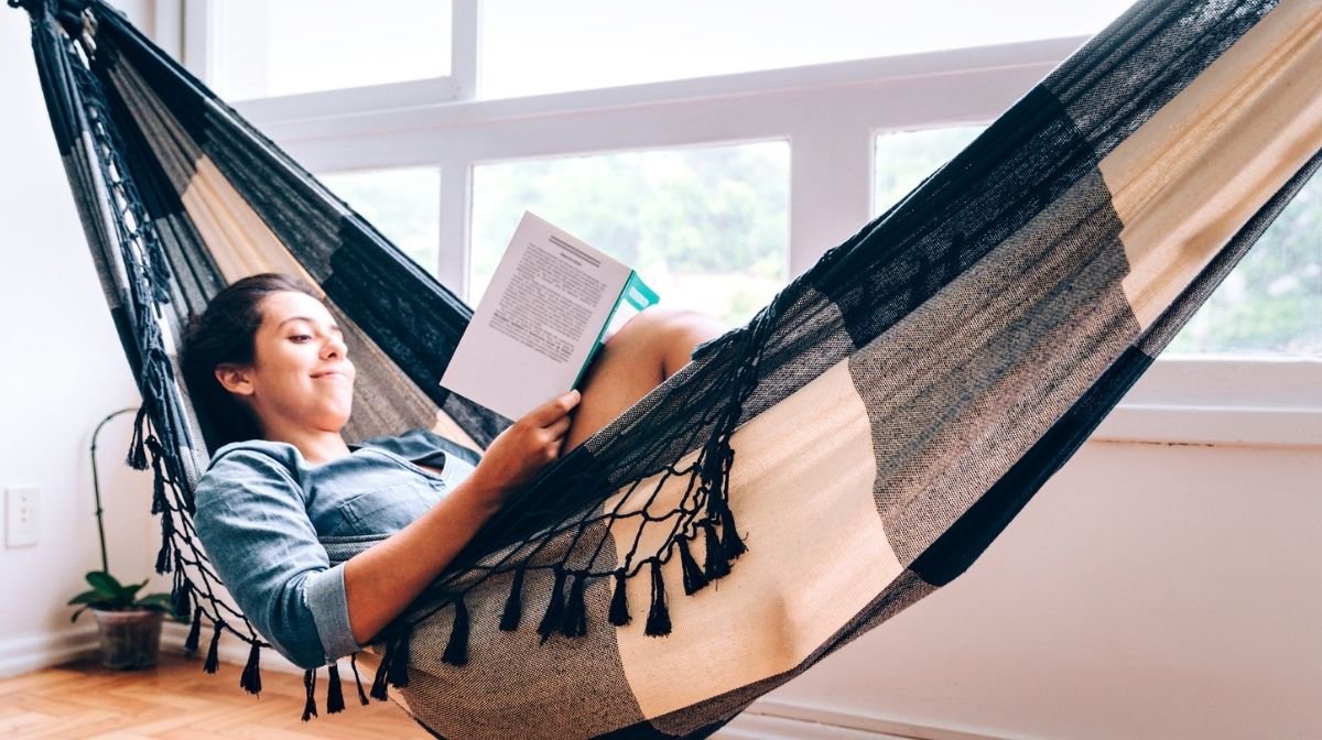 woman reading in a hammock