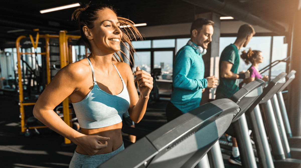 women running on treadmill