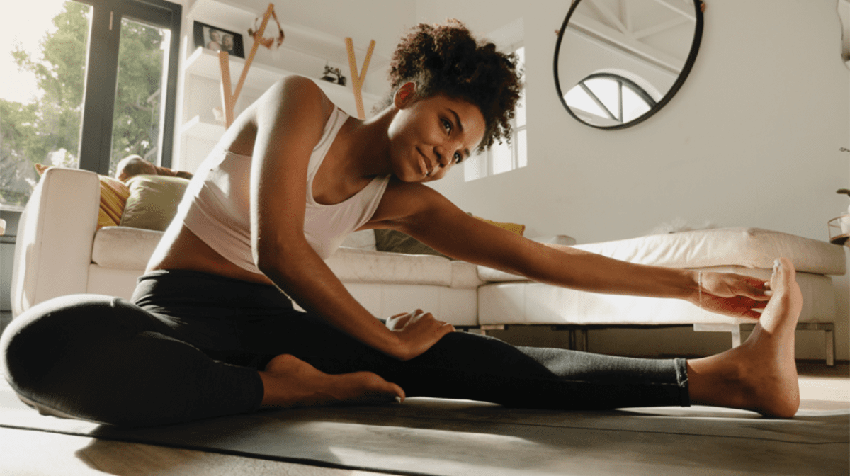 black woman stretching her leg