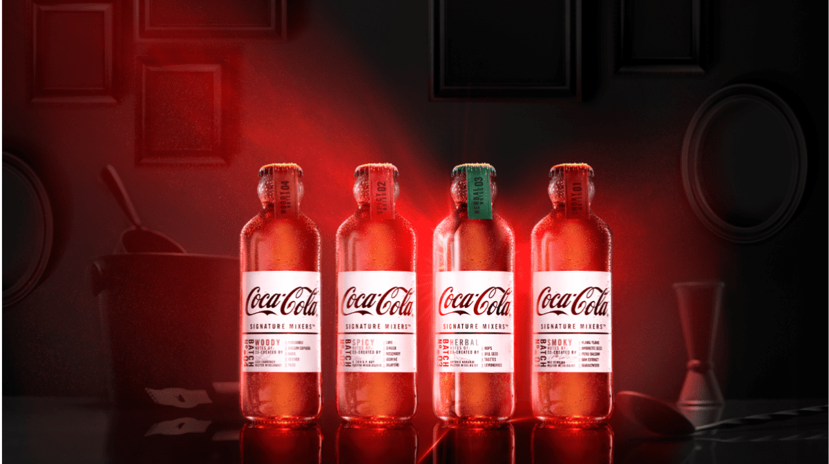 4 glowing signature mixers Coca Cola bottles