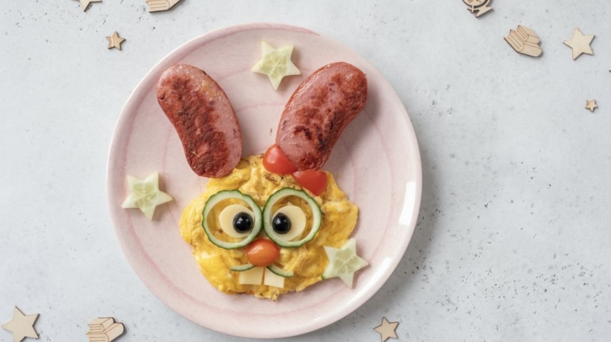 scrambled egg and sausages in the shape of a rabbit