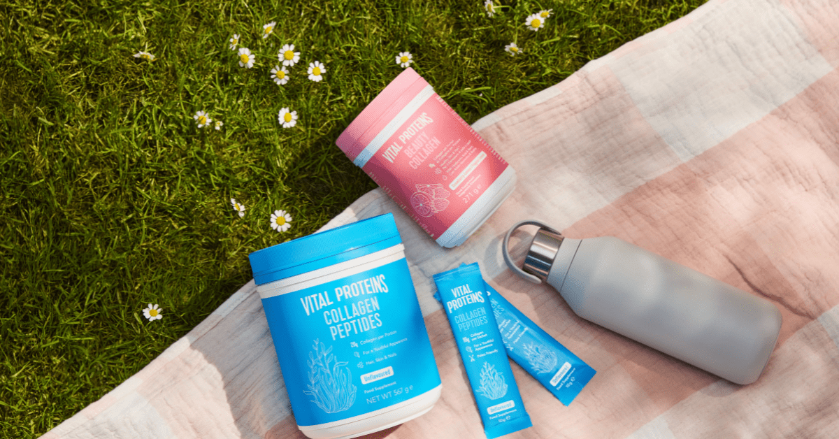 three vital proteins collagen products placed on a pink picnic rug on a field