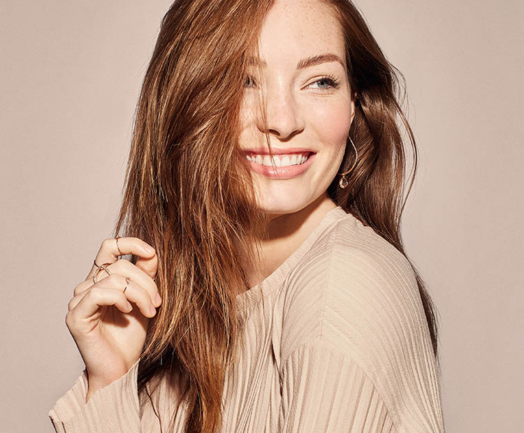 woman with long hair smiling 