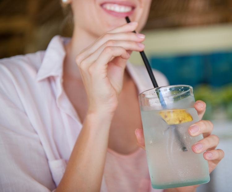 woman drinking coconut water