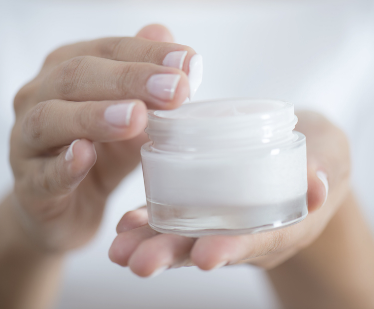 skin care cream in woman's hands