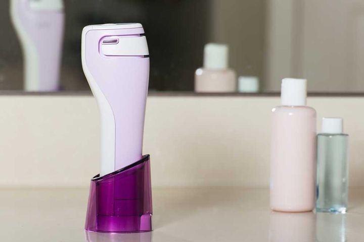 laser skin care device on bathroom counter