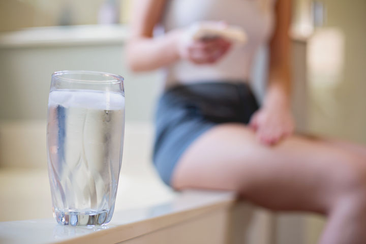 woman with a glass of water