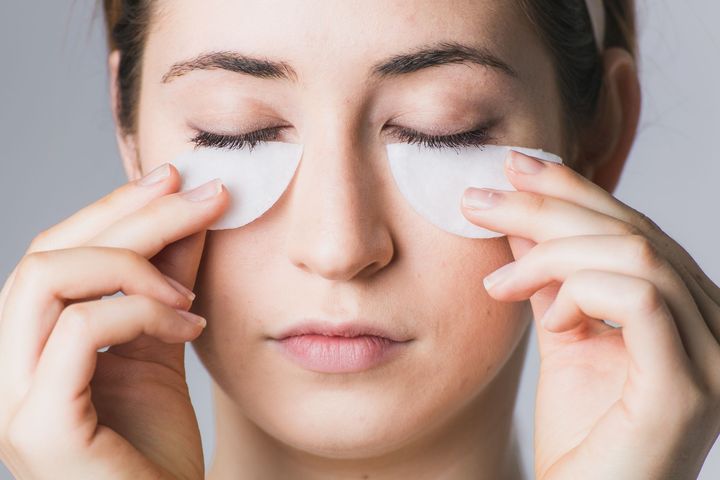 woman lifting eyelashes