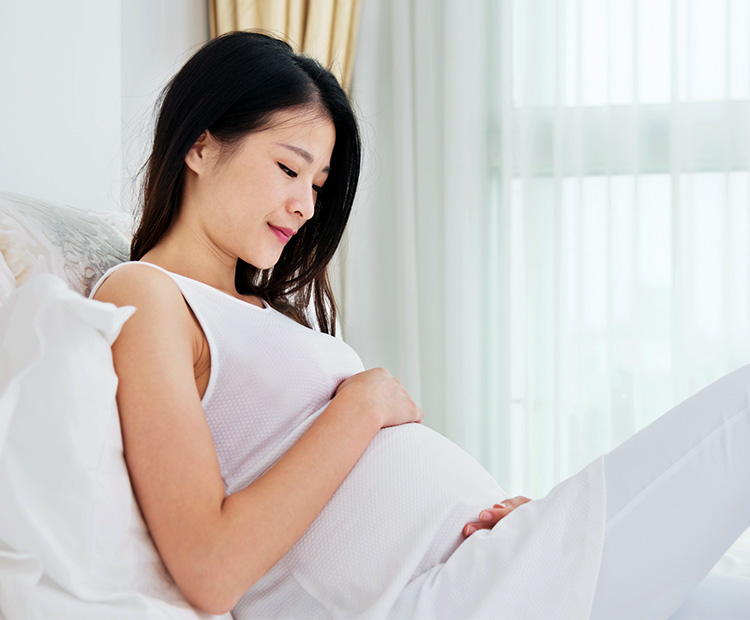 pregnant woman relaxing I Dermstore Blog