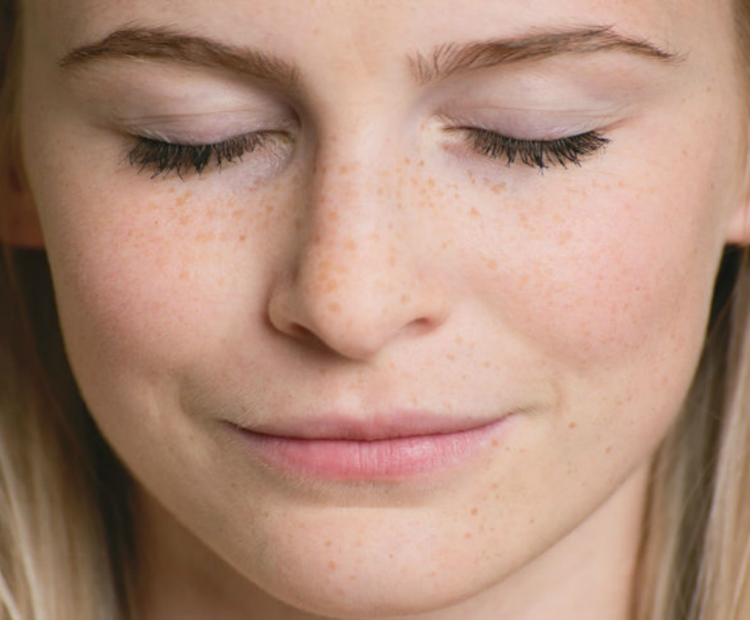 woman with eyes closed