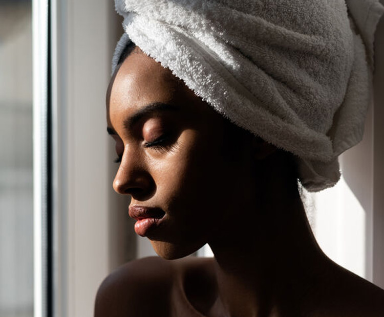 Woman applying hair mask