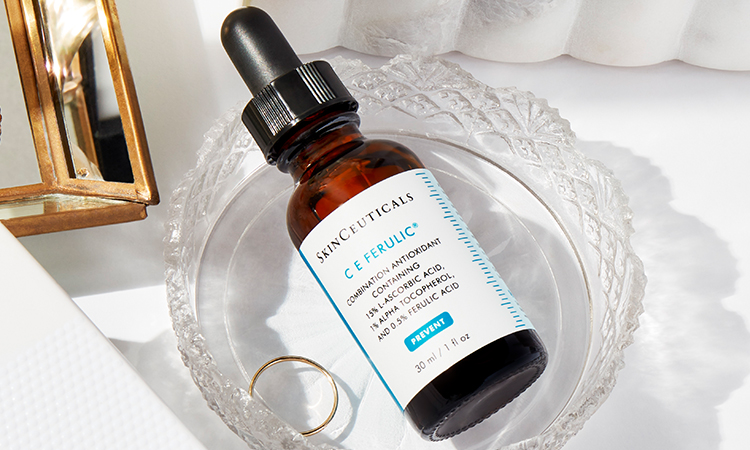 SkinCeuticals C E Ferulic amber bottle on a vanity table