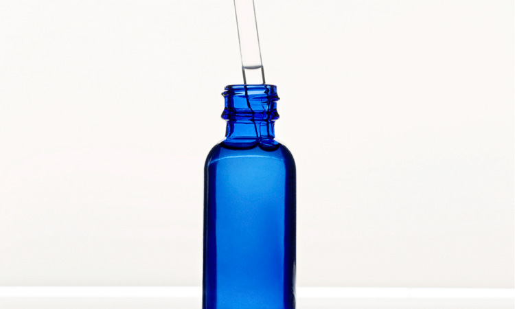 Blue bottle of skin care serum