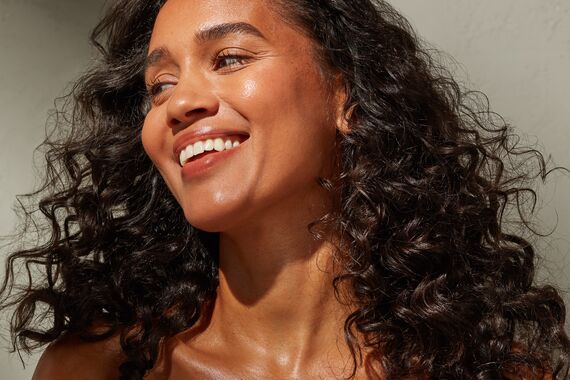 Skincare model with curly hair