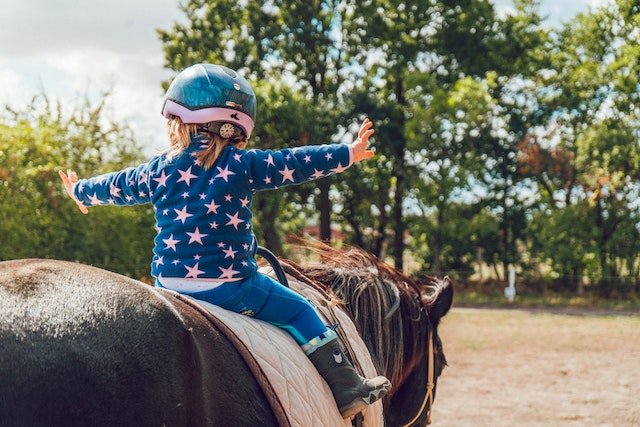 Toddler horse riding