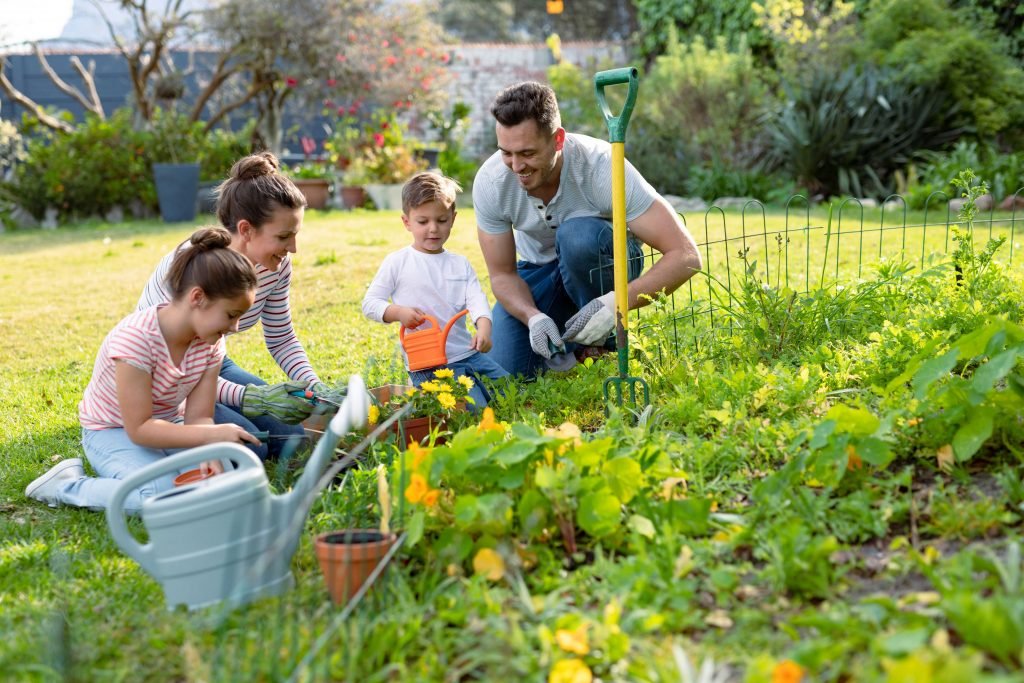 happy caucasian family gardening