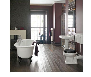 Darker bathroom with wooden flooring