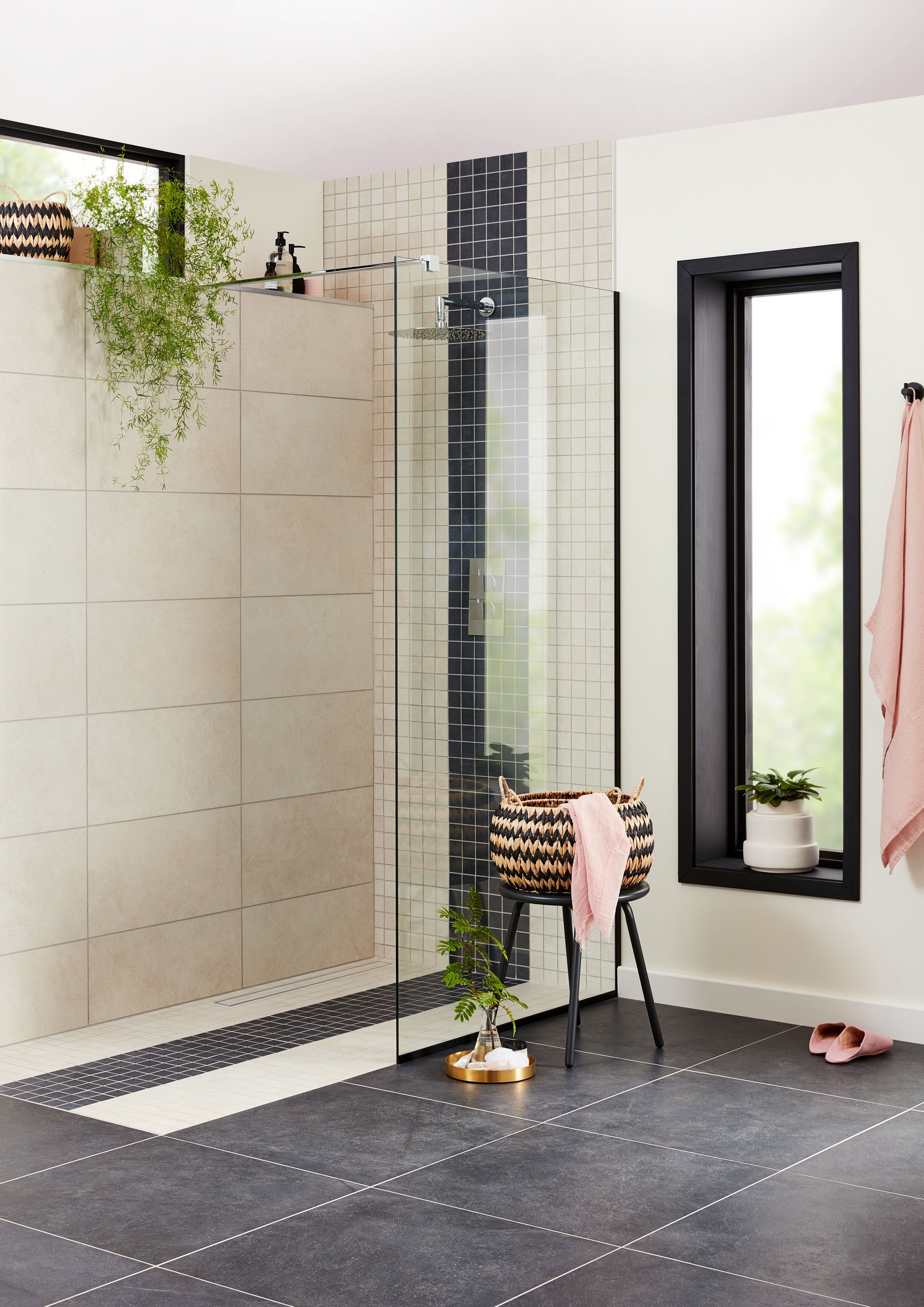 walk in shower with plants and basket with towels