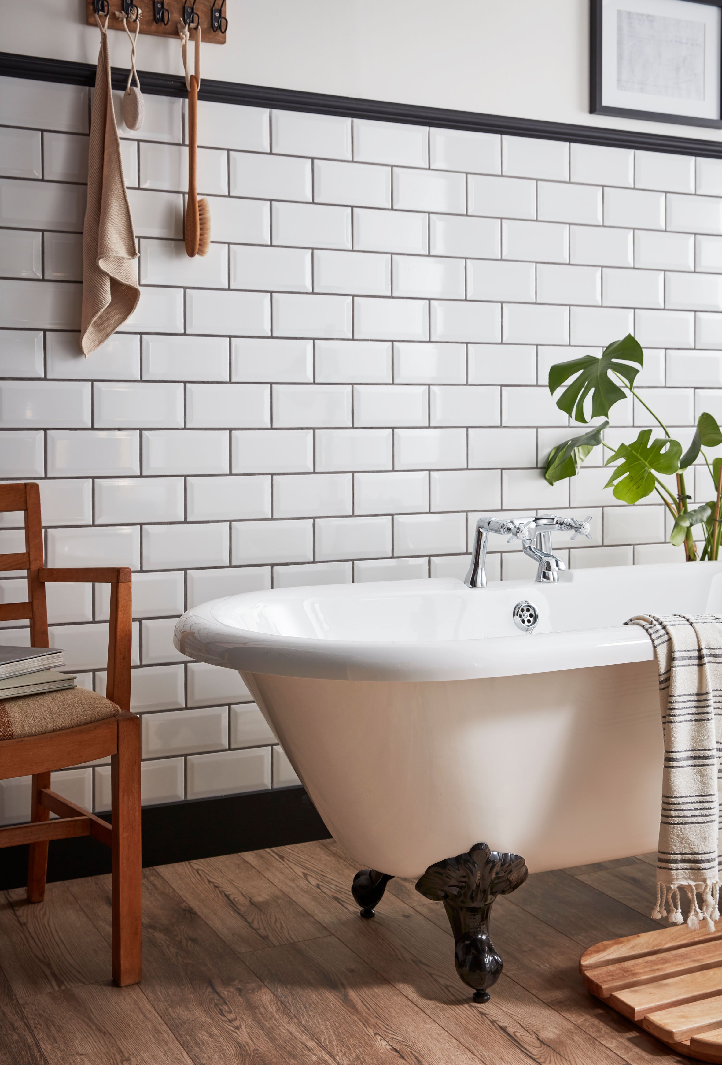 an image of a freestanding bath in a white tiled bathroom