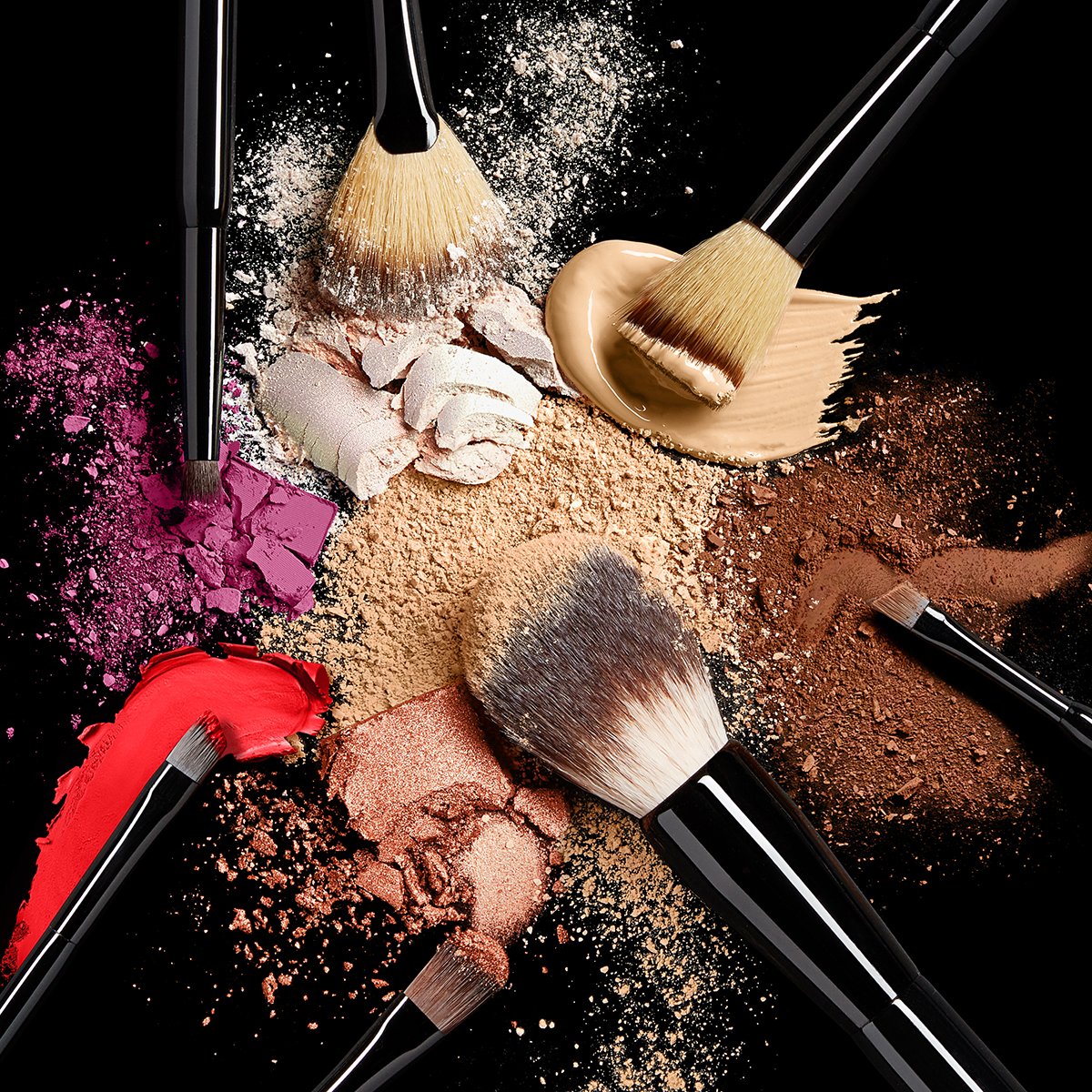 makeup brushes with coloured pigments and powders