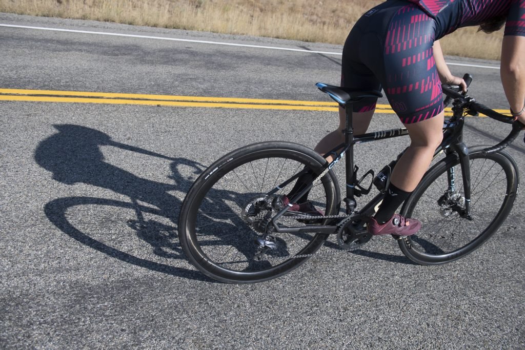 Woman riding Reynolds carbon wheels