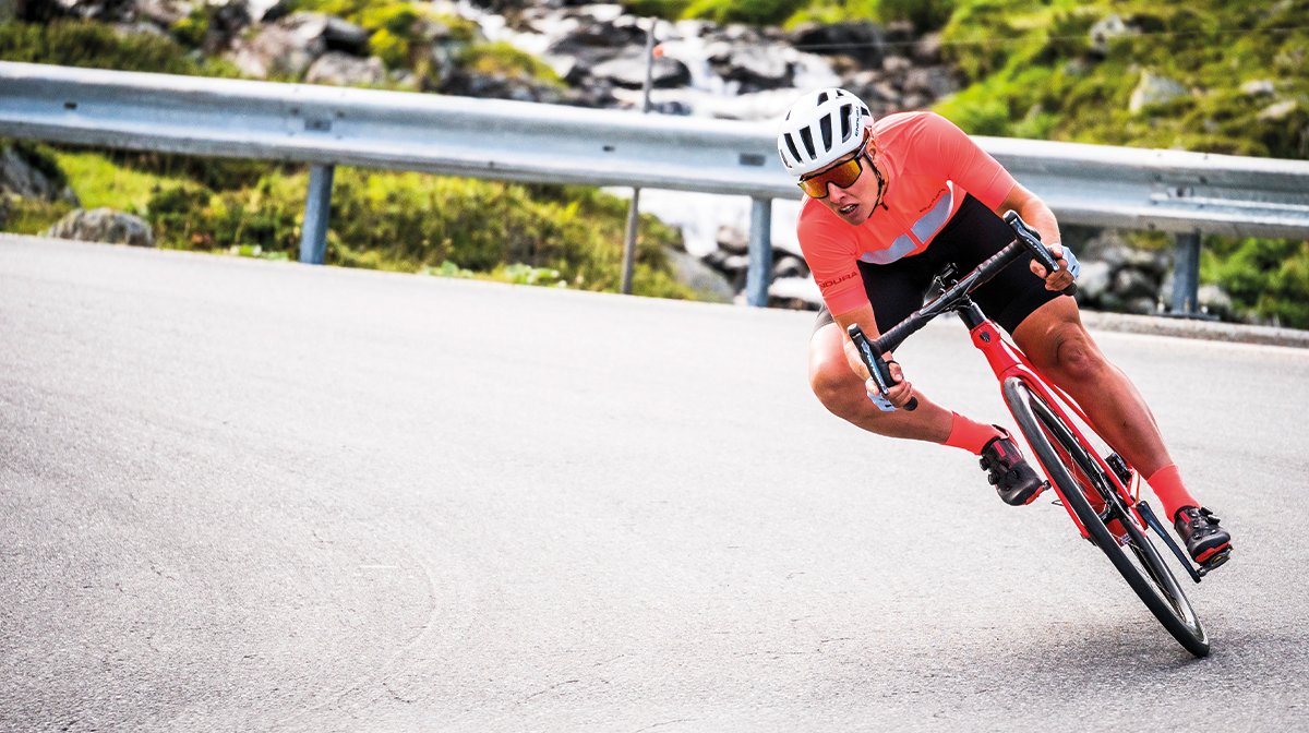 man on bike coming round corner