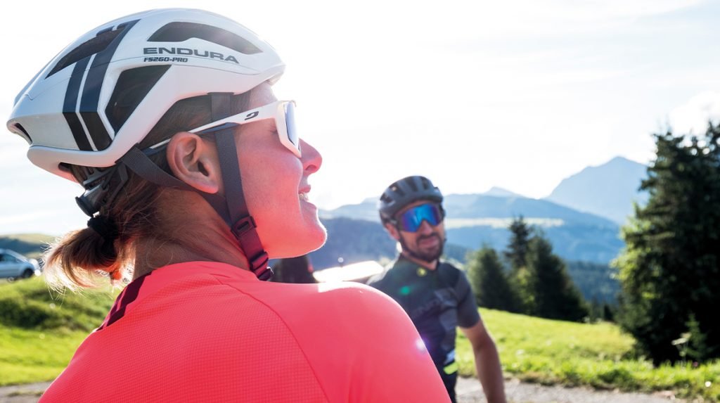 Woman in bicycle helmet and sunglasses