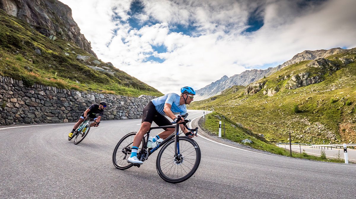 Cyclists take corner at pace