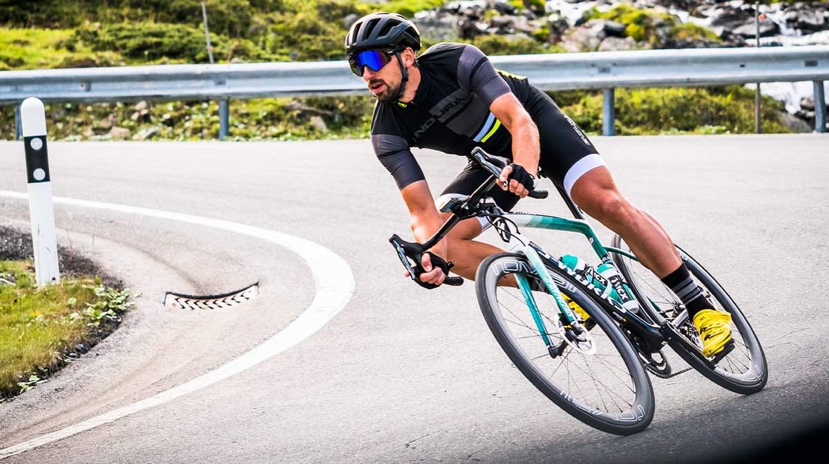 Road cyclist taking a bend sharply