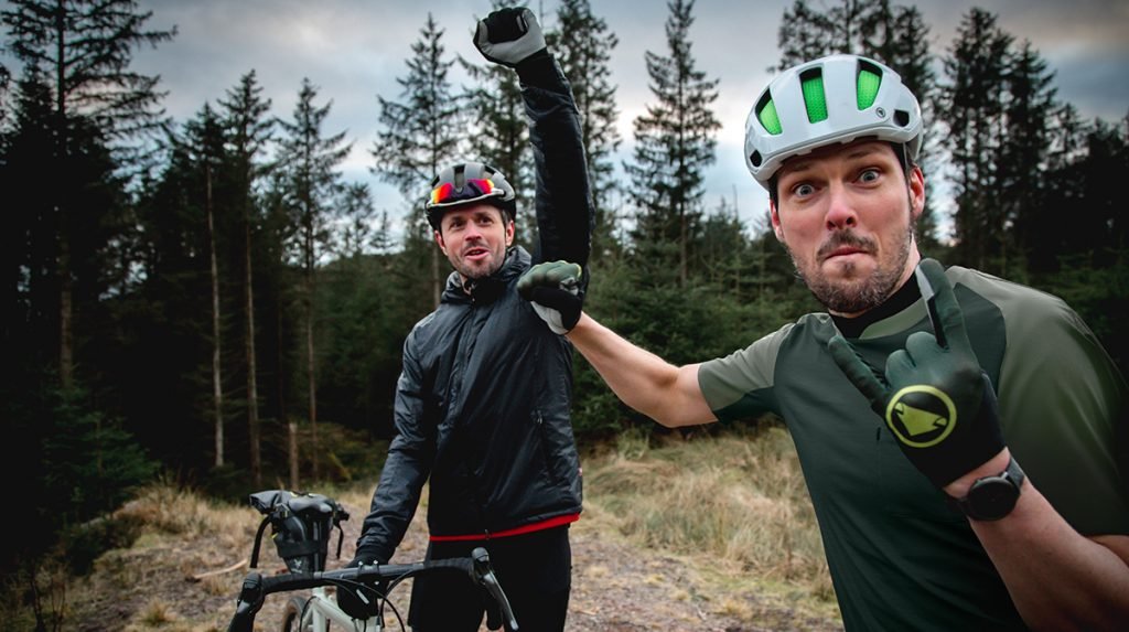 Two cyclists fistbump