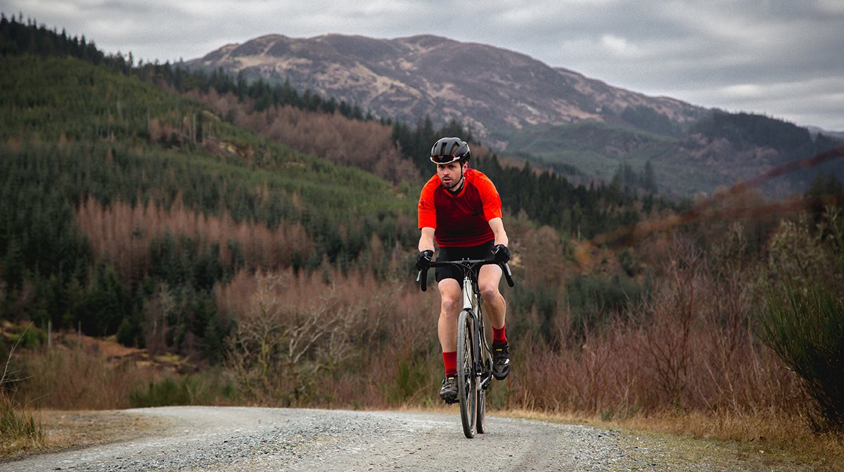 Endura cyclists heads towards camera in red Endura cycling gear