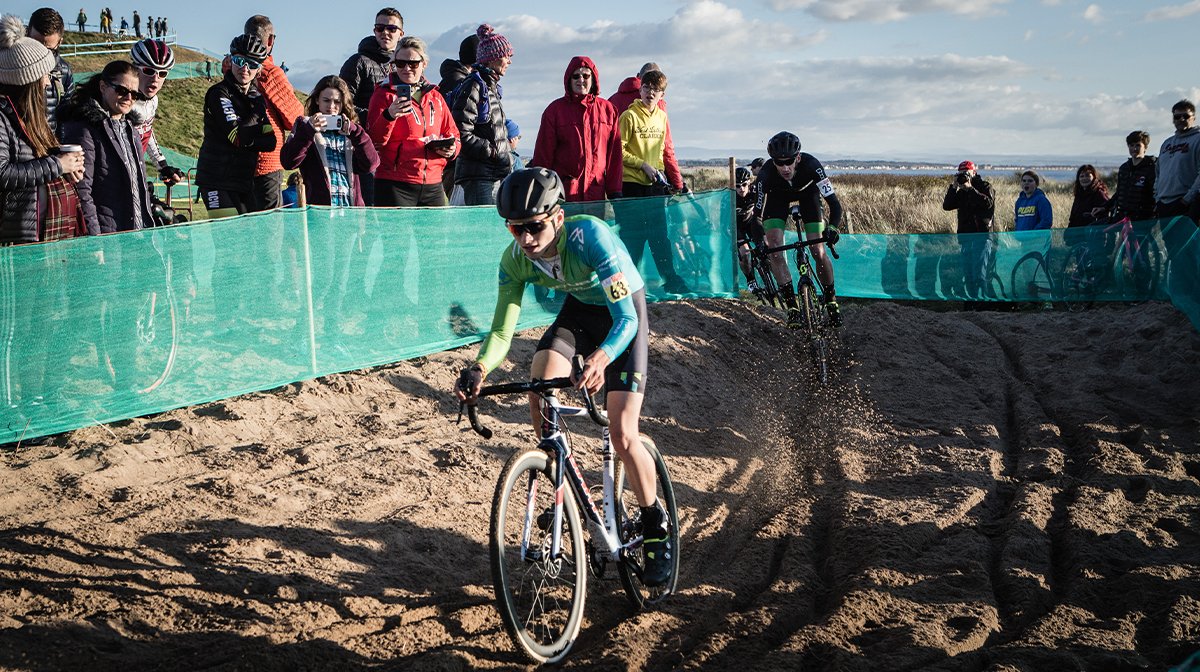 Cyclists ride across sand in Endura gear