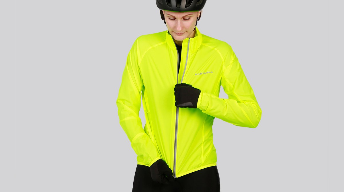 Lady zips up Yellow Endura high visibility jacket