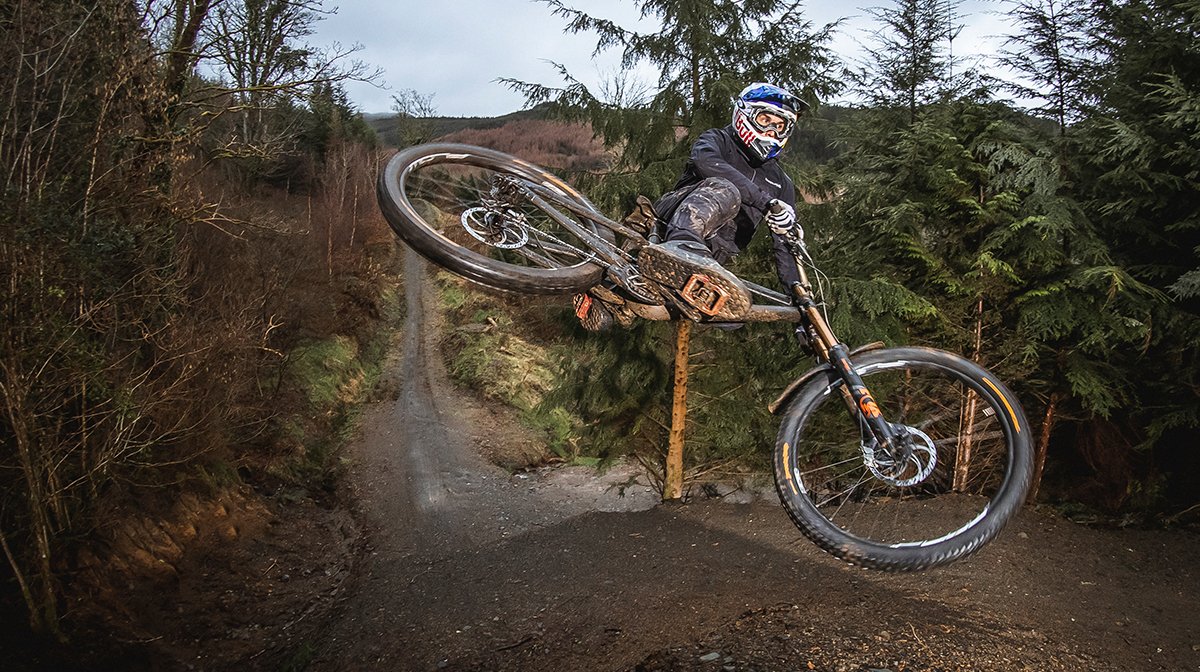 A man on a mtb performing a trick