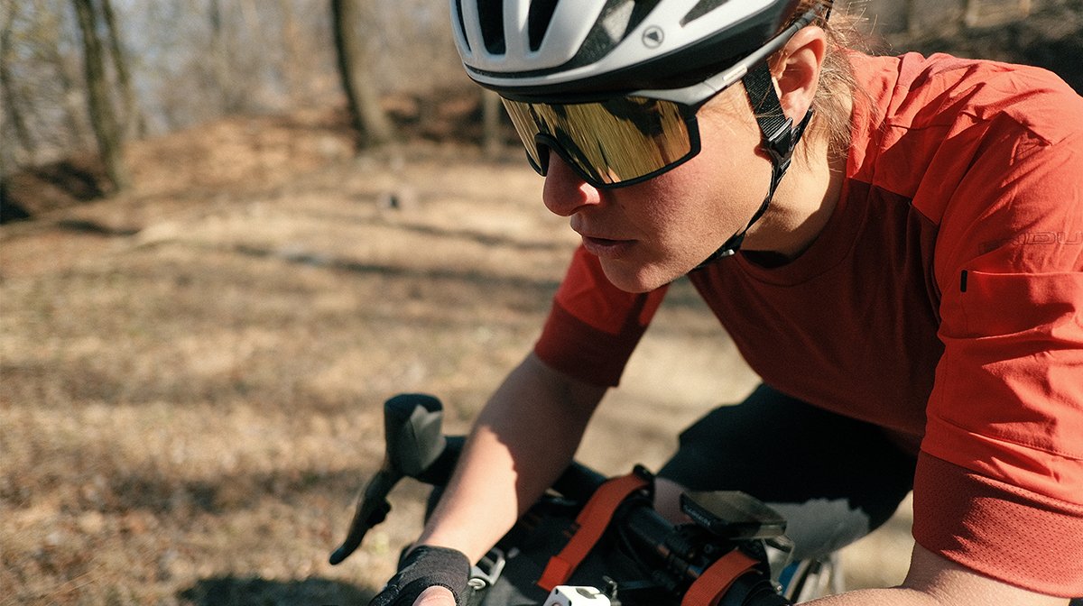 Nathalie Schneitter leans on bike in Endura gear