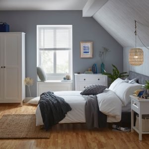 an image of a grey bedroom with a wooden floor