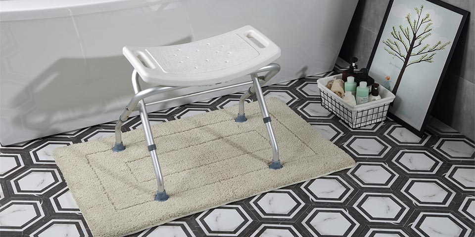 An image of an assisted living stool, placed on a white rug