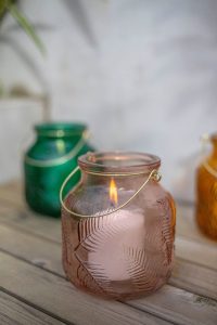 Lit candle in outdoor lantern