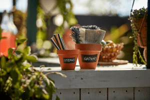 Terracotta pots as cutlery and napkin holders