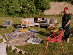 Angel Strawbridge arranging cosy outdoor seating
