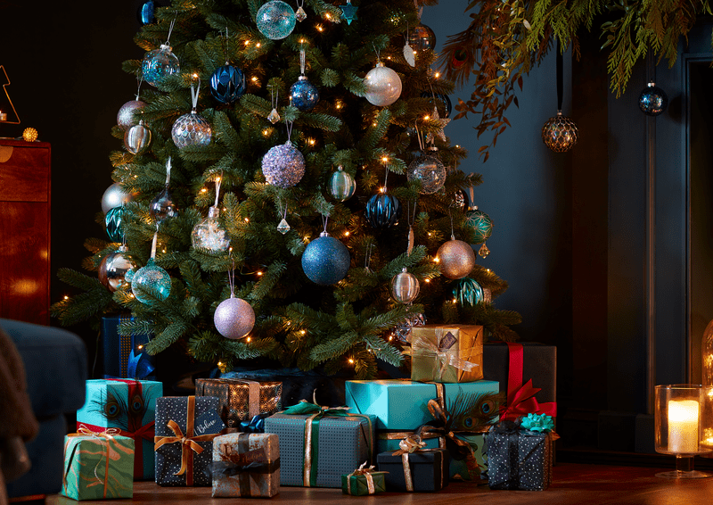 an image of a Christmas tree with presents under it