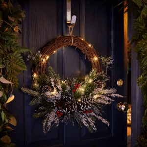 an image of a Christmas Winter wreath hanging on a front door 