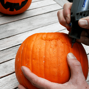 an image of a pumpkin being carved with a dremel tool 