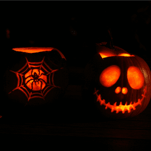 an image of glowing carved pumpkins in the dark 